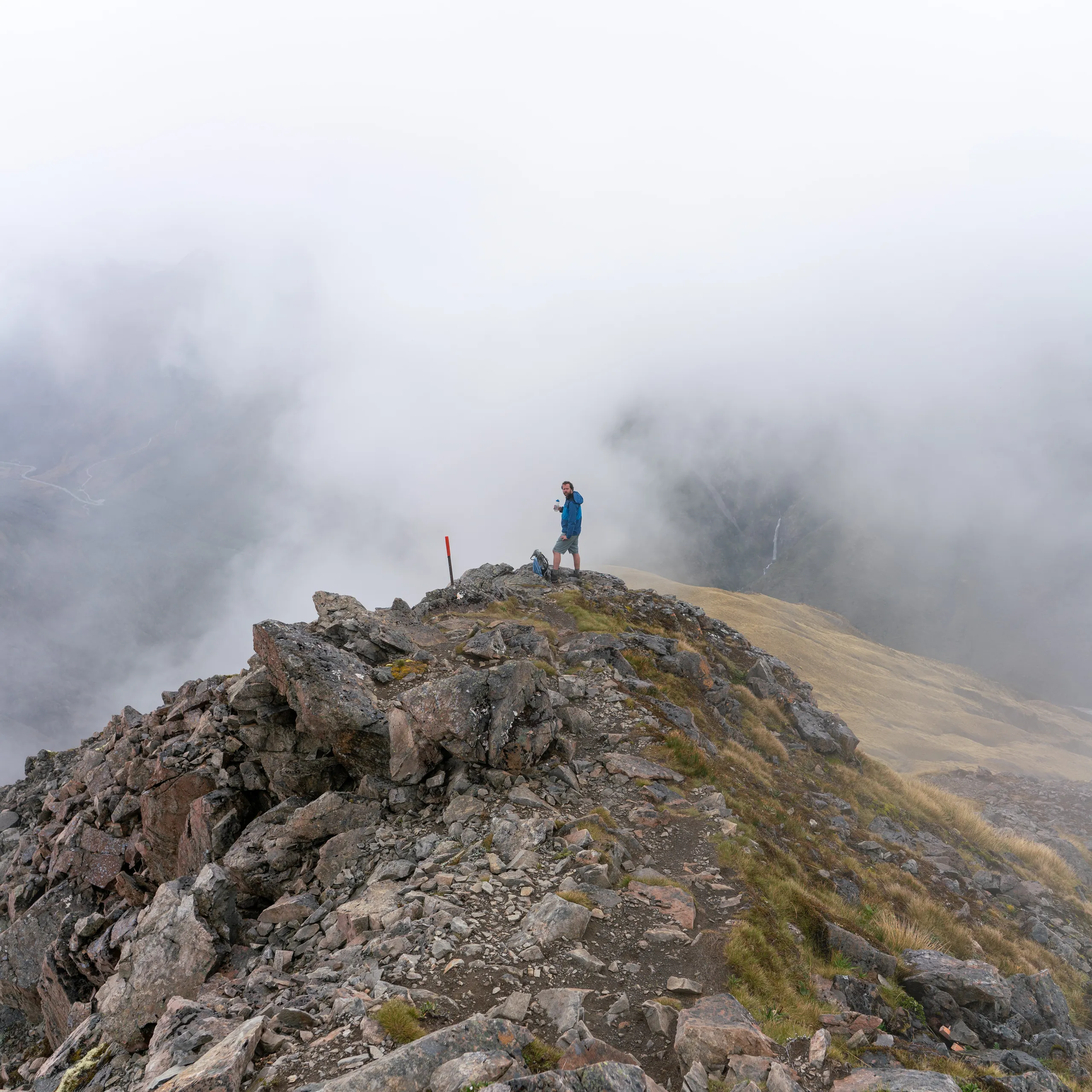 Water break on the cloudy descent. Devils Punchbowl Falls are just visible on the other side of the valley.