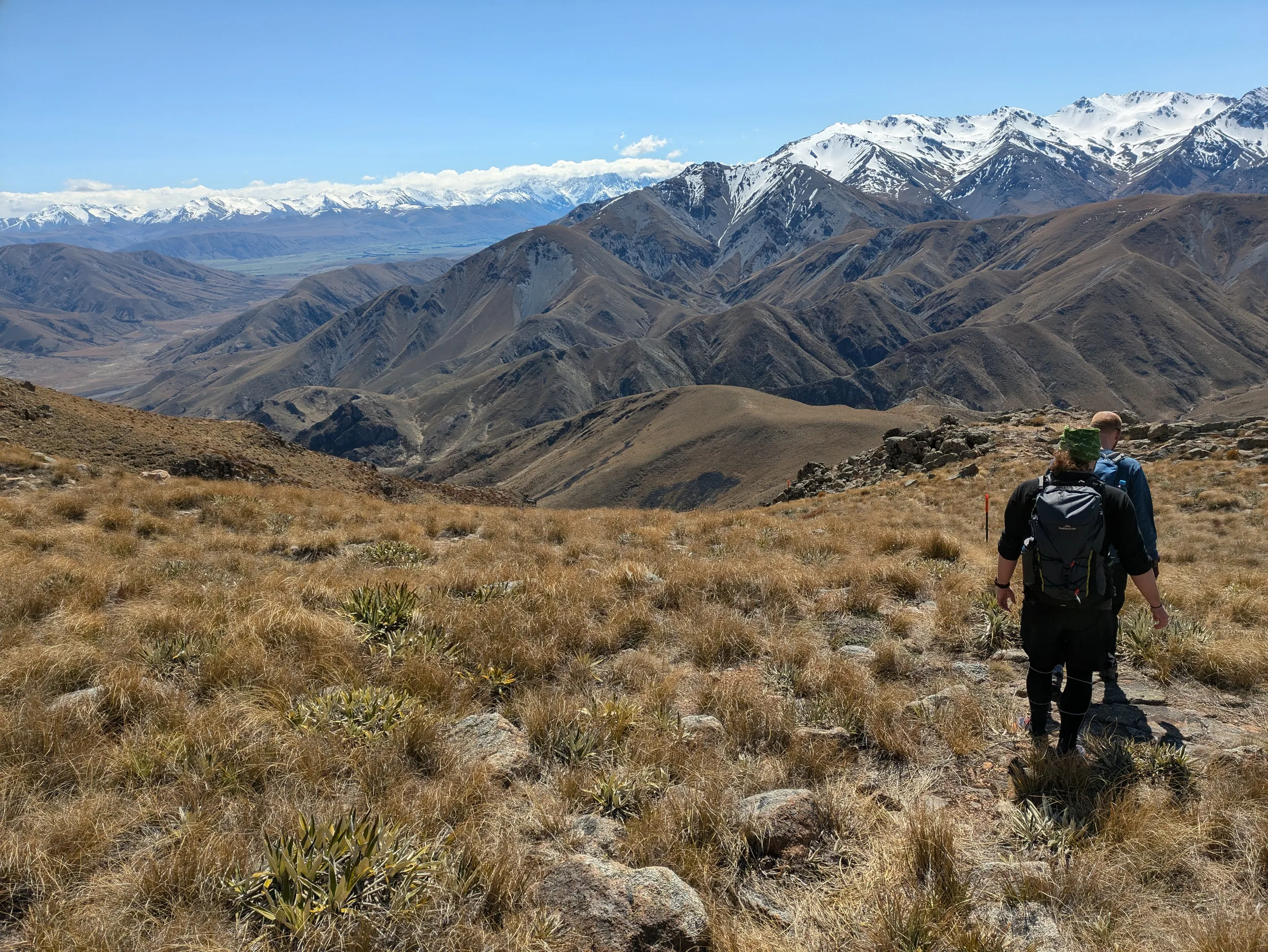 Gentle descent on the other side of the summit with stunning views inland