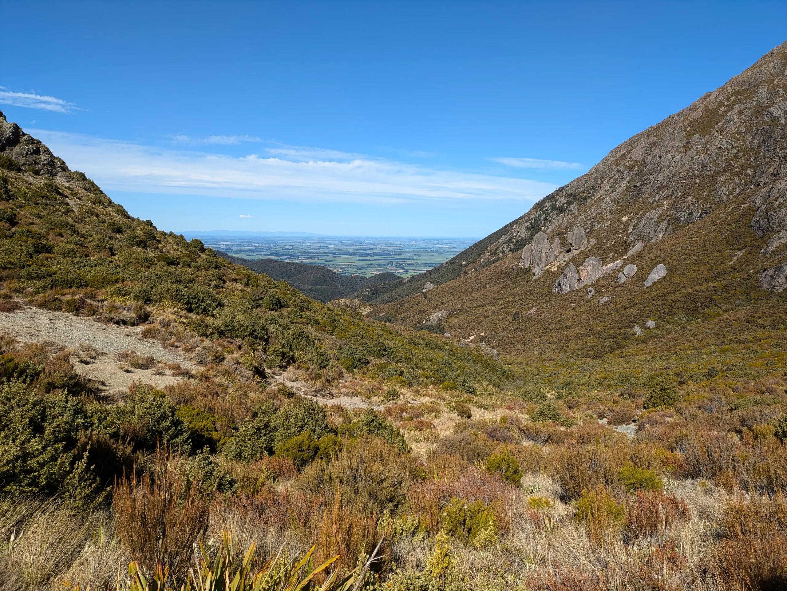 Looking out towards the plains from where the summit descent meets the main track at the northern saddle