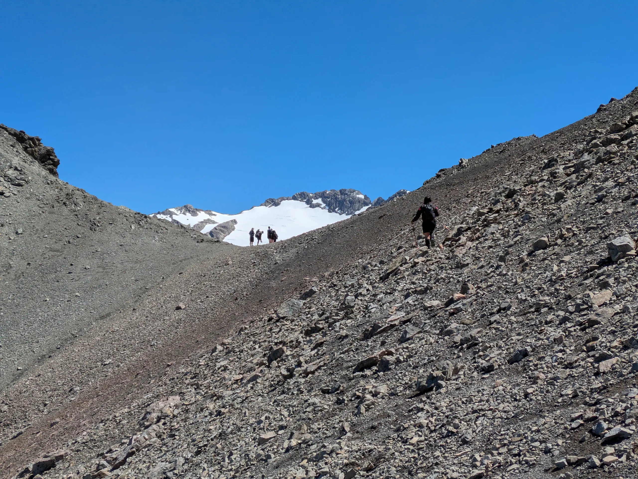 Sidling to the saddle below the peak